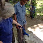 Camille shows Muthi Azule’s natural water source.